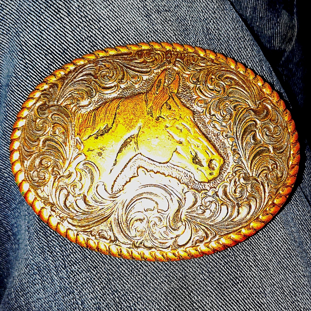 Crumrine belt buckle. Heavy silver plated with gold plated horse.